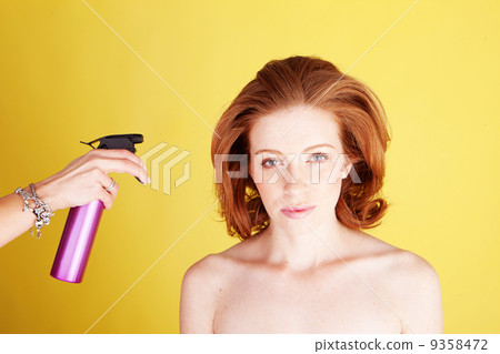 Hairstylist Applying Hair Spray Hairstylist Applying Hair Spray 9358472