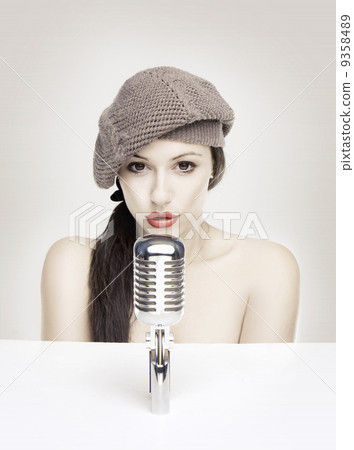 Sexy woman singing in retro mic Sexy woman singing in retro mic 9358489