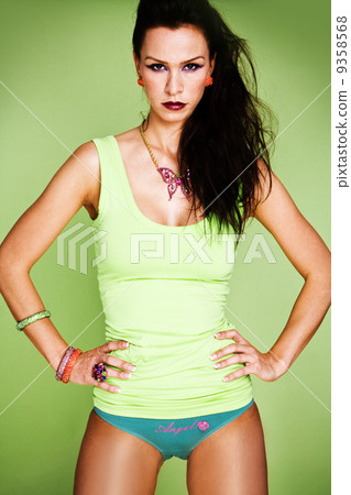 fashion woman on the green background 9358568
