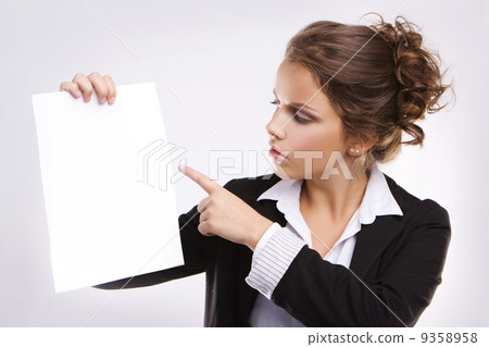 Beautiful businesswoman with blank paper 9358958