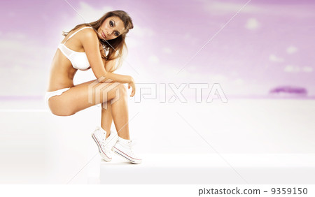 Sexy young woman wearing white lingerie on holiday Sexy young woman wearing white lingerie on holiday 9359150