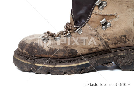Old trekking boot in mud Old trekking boot in mud 9361004