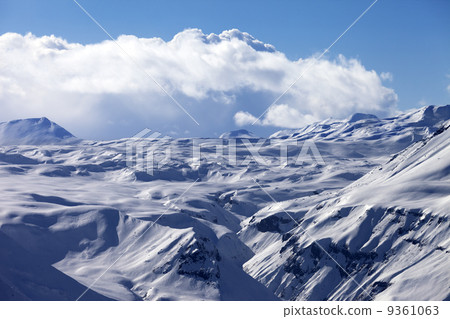 Snowy plateau and blue sky with clouds at nice evening Snowy plateau and blue sky with clouds at nice evening 9361063
