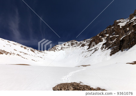 Snowy mountains and blue sky at nice winter day Snowy mountains and blue sky at nice winter day 9361076