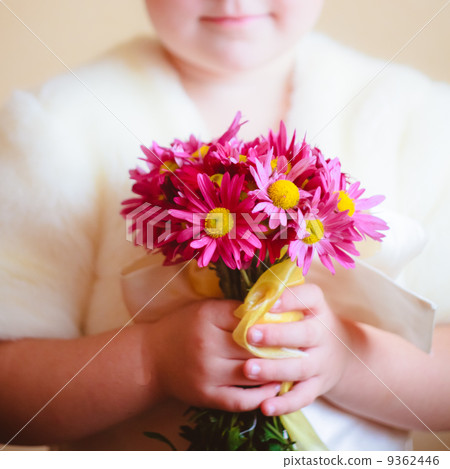 Little Girl With Pink Flowers Asters In Their Hands 9362446