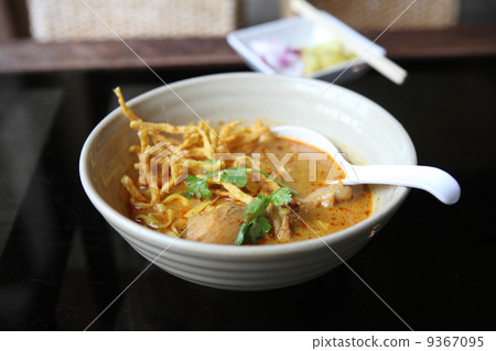 Noodle Khao soi , Thai food on wood background 9367095