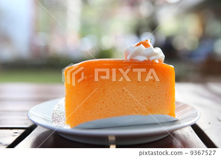 Orange cake on wood background 9367527