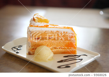 Orange cake on wood background 9368026