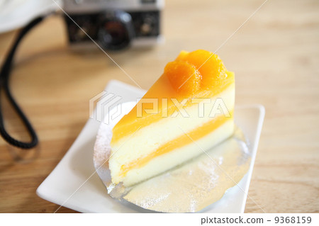 Orange cake on wood background 9368159