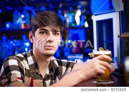 portrait of a young man at the bar portrait of a young man at the bar 9372829
