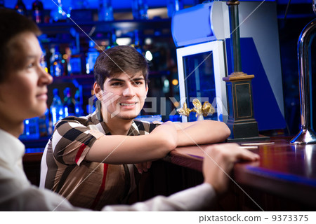 portrait of a young man at the bar portrait of a young man at the bar 9373375