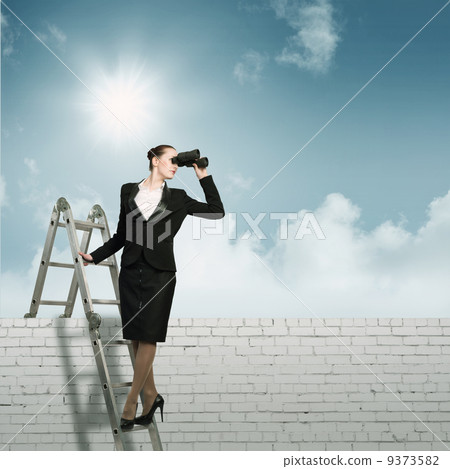 businesswoman looking through binoculars businesswoman looking through binoculars 9373582