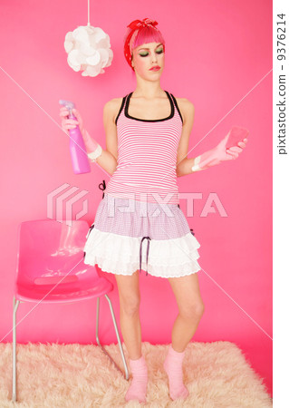 charwoman with pink hair working in pink room 9376214
