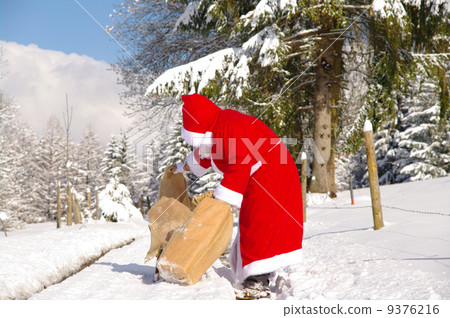 Santa Claus is looking in his bag 9376216
