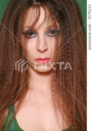 Woman with long hairs green concept Woman with long hairs green concept 9376221