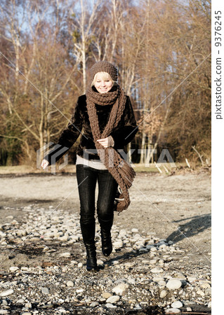 young woman has fun outdoors in autumn scarf young woman has fun outdoors in autumn scarf 9376245
