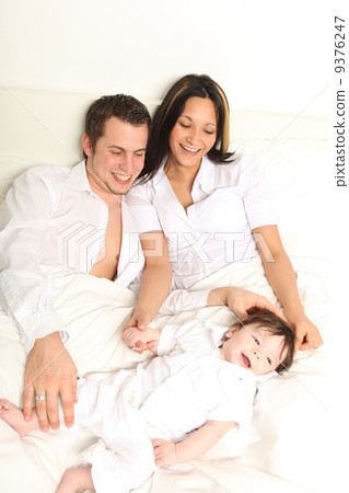 Family in white bed Family in white bed 9376247