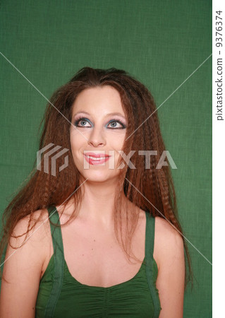 Woman with long hairs green concept Woman with long hairs green concept 9376374