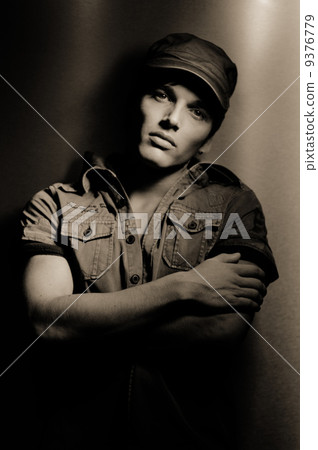 man wearing shirt with a cap 9376779