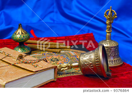 two Tibetan ritual bell and a book 9376864