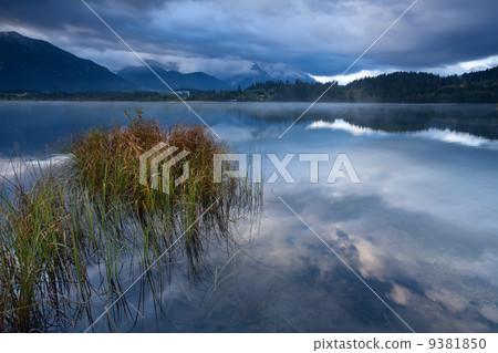 clouded morning on Barmsee lake in Alps 9381850