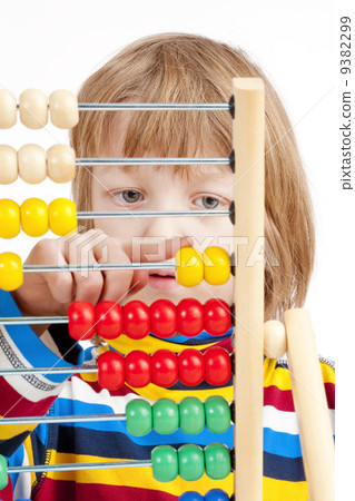 Child Counting on Colorful Wooden Abacus 9382299