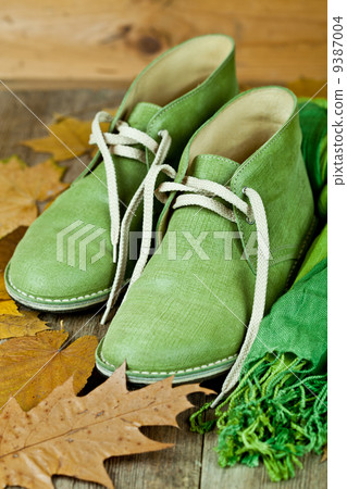 leather boots, scarf and yellow leaves leather boots, scarf and yellow leaves 9387004