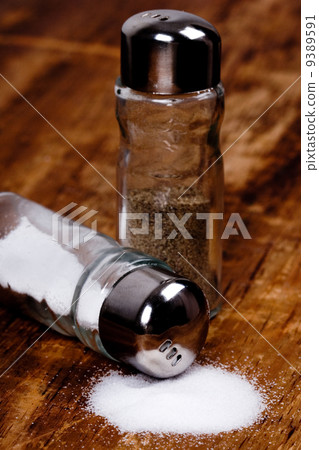 salt and black pepper in shakers salt and black pepper in shakers 9389591