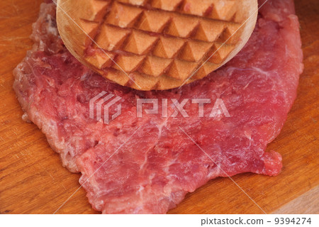 wooden hammer for beating the meat and meat 9394274