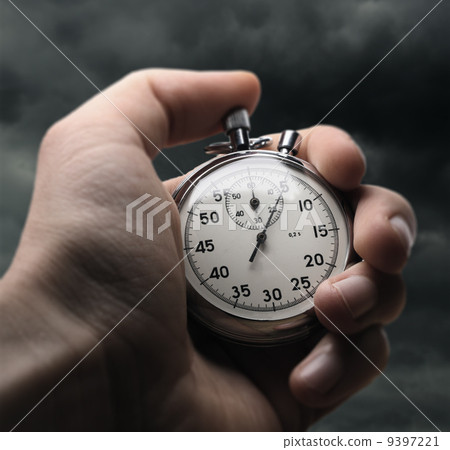 Hand holding stopwatch Hand holding stopwatch 9397221
