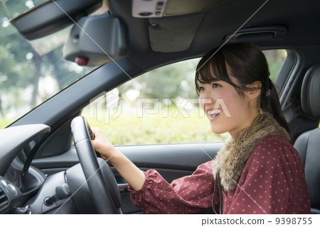 A woman driving happily A woman driving happily 9398755