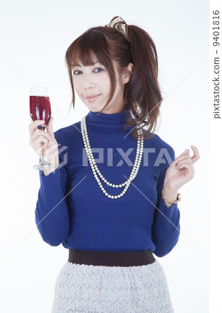 A woman with a wine glass A woman with a wine glass 9401816