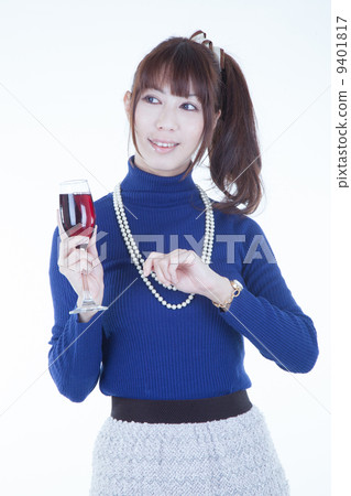 A woman with a wine glass A woman with a wine glass 9401817