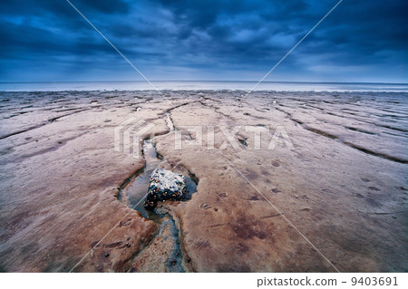 mud on North sea bottom at low tide 9403691