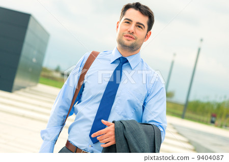 Handsome businessman or manager going home 9404087