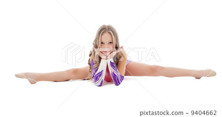 Studio shot of cute young gymnast sitting on split 9404662