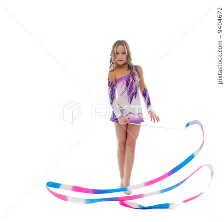 Athlete rhythmic gymnastics performs with ribbon 9404672