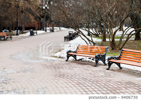 empty wooden benches in city park empty wooden benches in city park 9406730