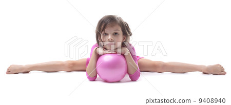 Image of adorable little gymnast doing split 9408940