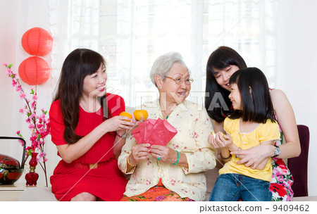 three generations family celebrating chinese new year 9409462