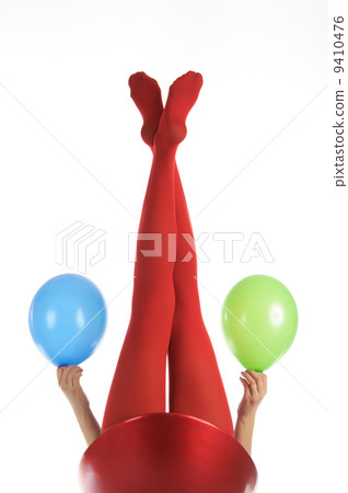Female feet in red stockings with balloons Female feet in red stockings with balloons 9410476