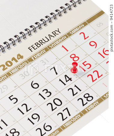 Calendar page with red thumbtack on February 14 2014. 9414723