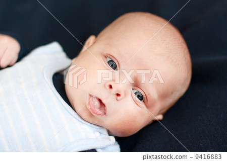 Adorable baby boy with blue eyes Adorable baby boy with blue eyes 9416883
