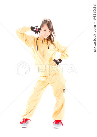 A pretty cheerful girl who dances hip-hop dance A pretty cheerful girl who dances hip-hop dance 9418538