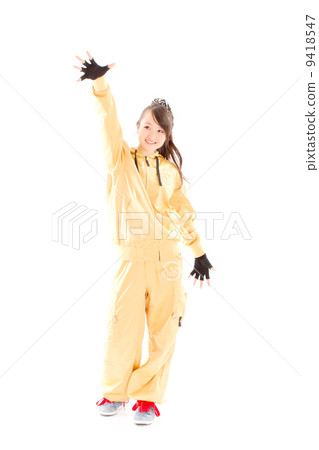 A pretty cheerful girl who dances hip-hop dance 9418547