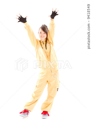 A pretty cheerful girl who dances hip-hop dance A pretty cheerful girl who dances hip-hop dance 9418549