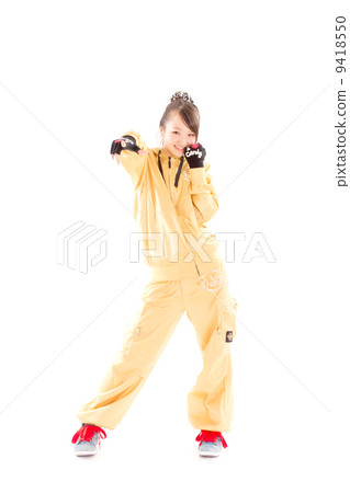 A pretty cheerful girl who dances hip-hop dance 9418550