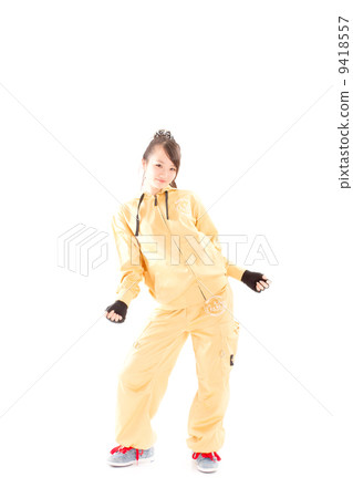 A pretty cheerful girl who dances hip-hop dance 9418557