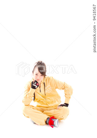 A pretty cheerful girl who dances hip-hop dance 9418567