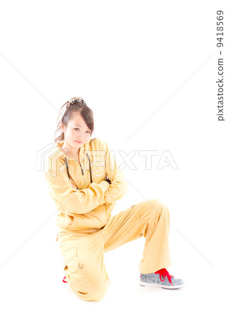 A pretty cheerful girl who dances hip-hop dance 9418569